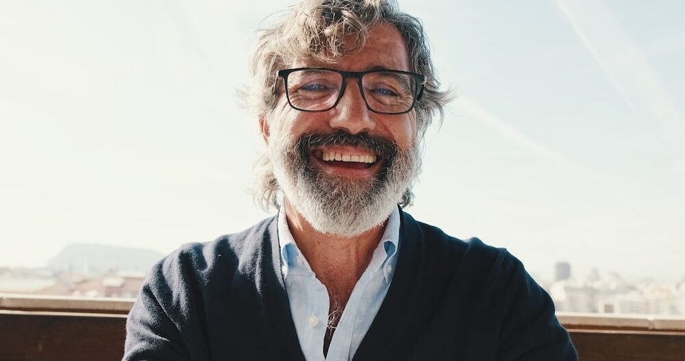 Close-up,Of,Mature,Man,Taking,Selfie,While,Standing,On,Balcony,