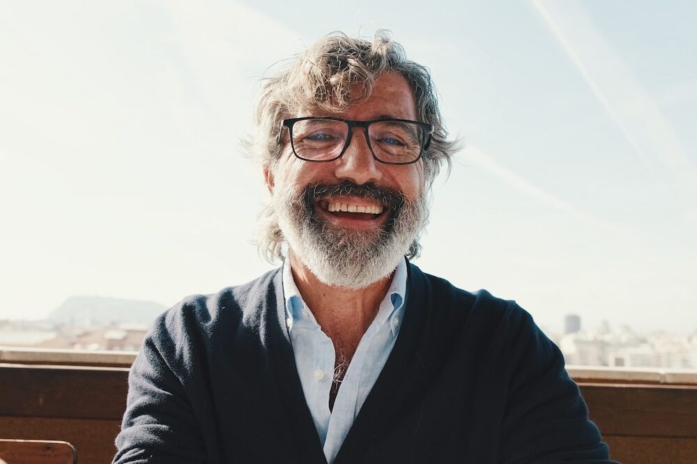 Close-up,Of,Mature,Man,Taking,Selfie,While,Standing,On,Balcony,
