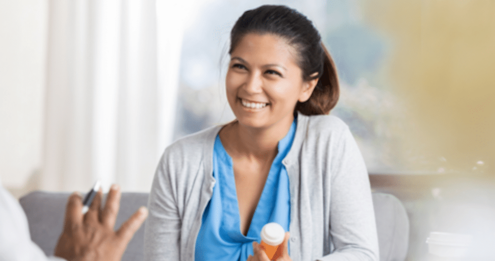 Woman smiling talking to psychiatrist and getting ADHD medications